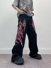 A knife flame embroidered wide-leg jeans
