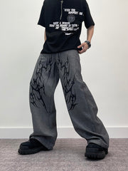 A knife thorn-printed patchwork wide-leg denim pants