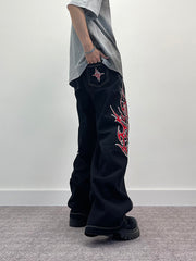 A knife flame embroidered wide-leg jeans