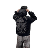 A heavyweight hoodie with a knitted cross pattern