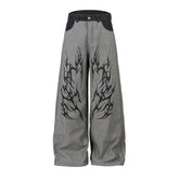 A knife thorn-printed patchwork wide-leg denim pants
