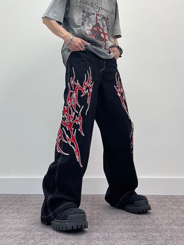 A knife flame embroidered wide-leg jeans