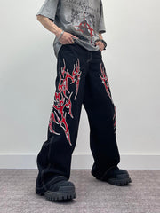 A knife flame embroidered wide-leg jeans