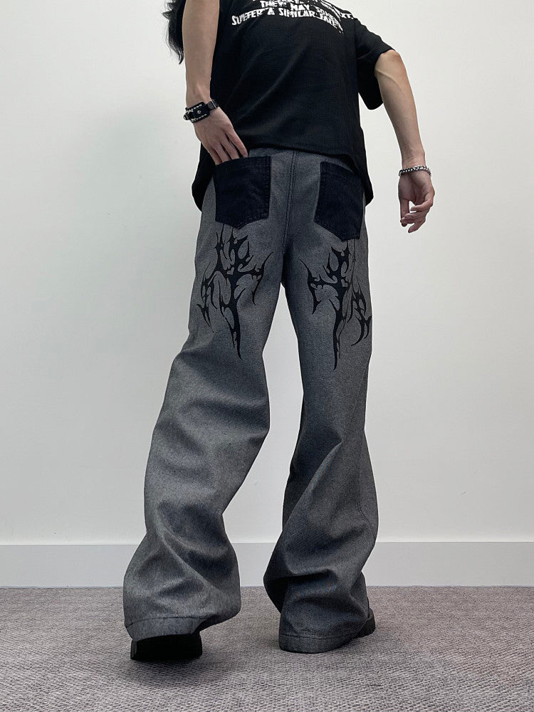 A knife thorn-printed patchwork wide-leg denim pants
