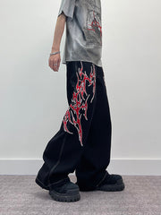 A knife flame embroidered wide-leg jeans