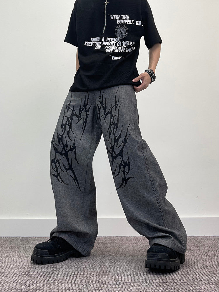 A knife thorn-printed patchwork wide-leg denim pants