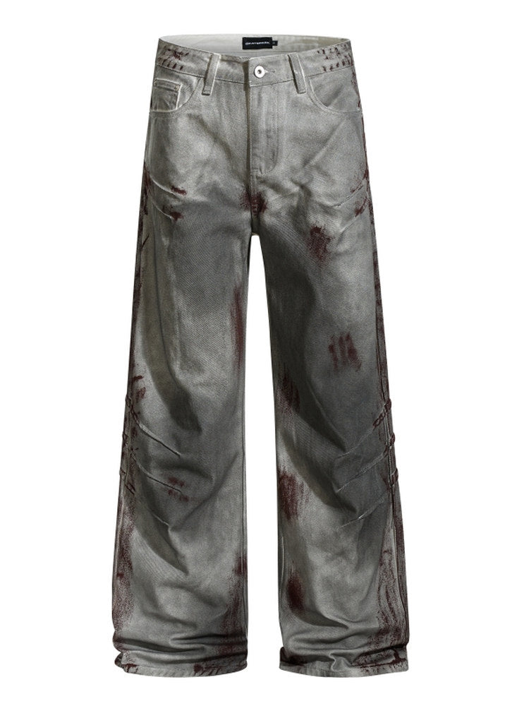 A knife-shaped blood-stained scratch mark on a pair of denim jeans