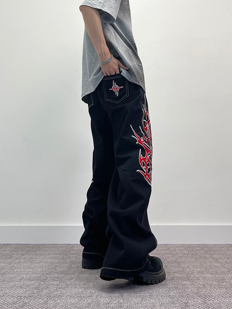A knife flame embroidered wide-leg jeans
